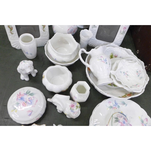 849 - A collection of Aynsley china including a table lamp base, a vase, three photograph frames, etc.