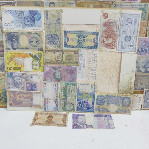 860 - A collection of mounted banknotes, mainly foreign, a Peppiatt £1 note and an O'Brien ten shillings n... 