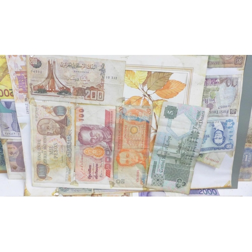 860 - A collection of mounted banknotes, mainly foreign, a Peppiatt £1 note and an O'Brien ten shillings n... 