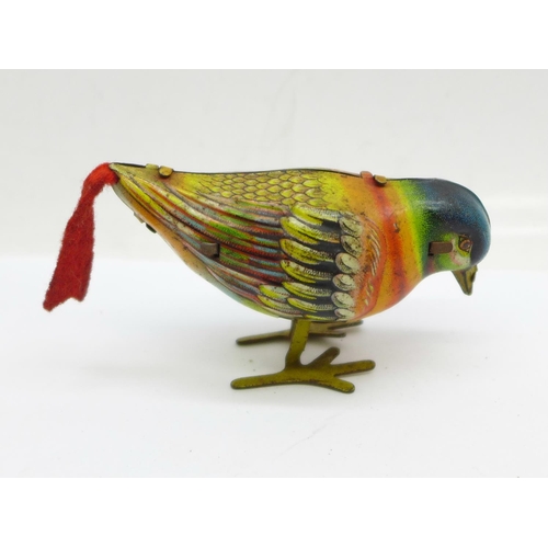 888 - A Kohler Germany tin-plate clockwork bird toy, no key