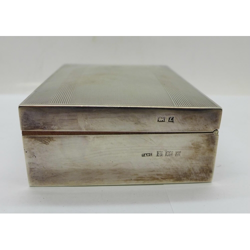 891 - A silver cigarette box, with inscription, width 12.5cm