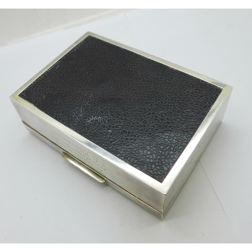 891 - A silver cigarette box, with inscription, width 12.5cm