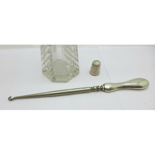 892 - A silver mounted scent atomiser, a silver handled boot hook and a silver Charles Horner thimble