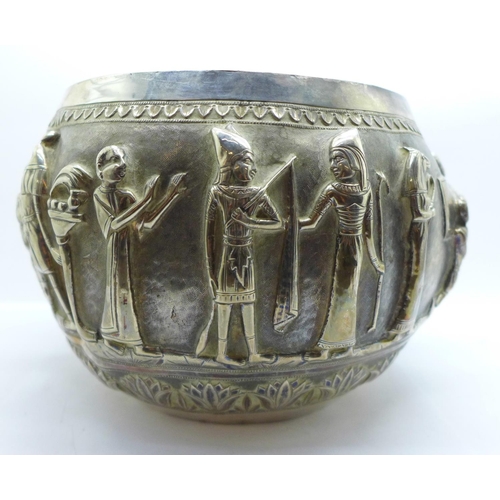 892A - An Egyptian embossed bowl with Pharoahs and mythological creatures, height 14cm