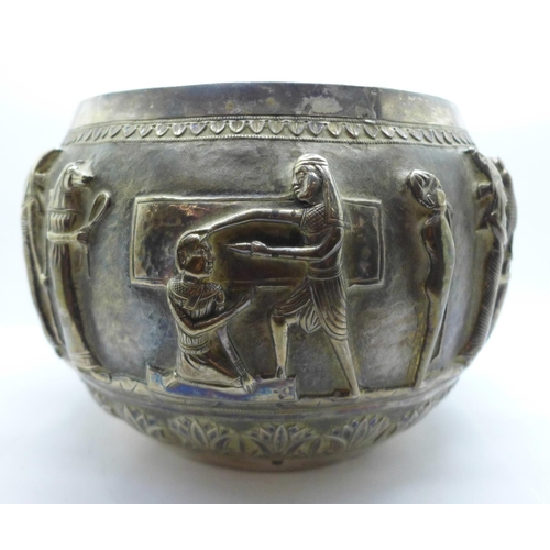 892A - An Egyptian embossed bowl with Pharoahs and mythological creatures, height 14cm