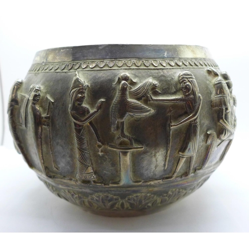 892A - An Egyptian embossed bowl with Pharoahs and mythological creatures, height 14cm