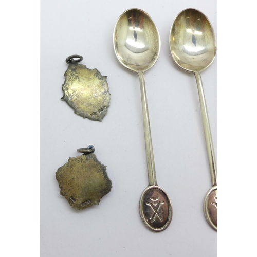 901 - Four silver spoons and two silver fobs including one football, 51g