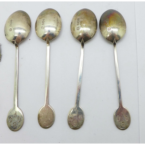 901 - Four silver spoons and two silver fobs including one football, 51g