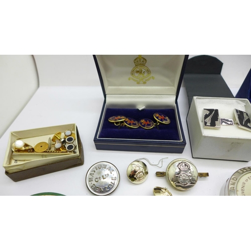 917 - Cufflinks including Concorde, a mother of pearl button set, military and other badges, etc.