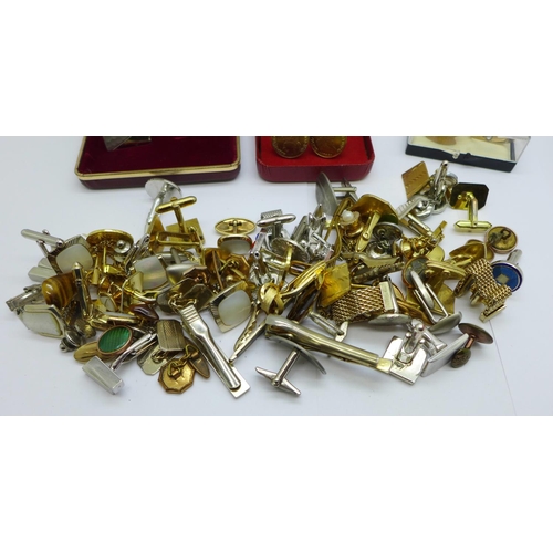 933 - A collection of cufflinks and tie-pins