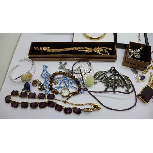 945 - Costume jewellery including a rolled gold bangle, etc.