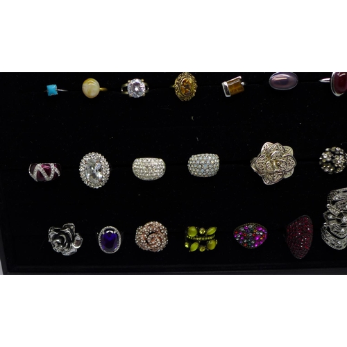 953 - Forty-three costume rings in a display tray