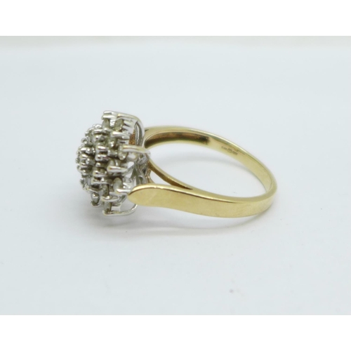 968 - A 9ct gold, twenty-five diamond cluster ring, approximately 0.85ct diamond weight, 4.9g, S