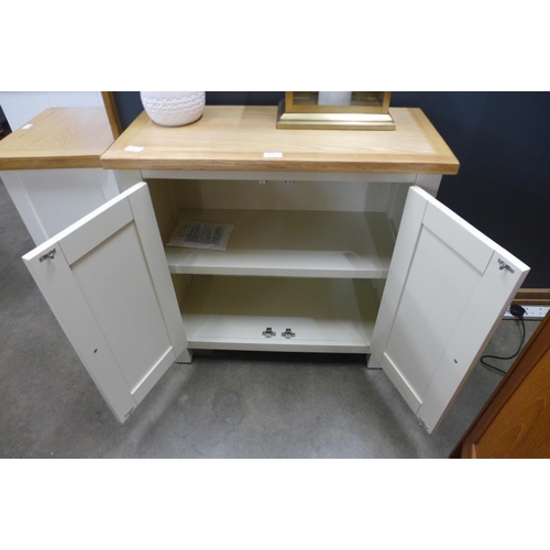 1426 - A Hampshire painted oak two door mini sideboard -damage to rear right leg* this lot is subject to VA... 