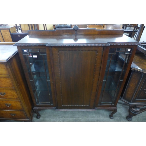 106 - A mahogany breakfront three door display cabinet