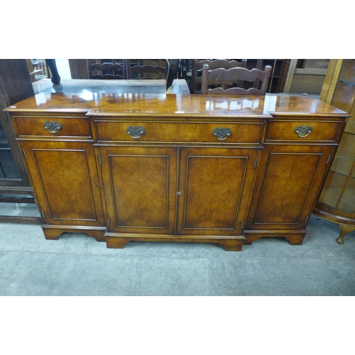 112 - A burr walnut breakfront sideboard