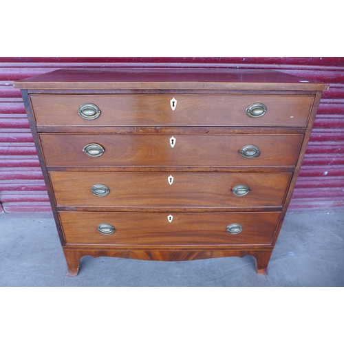 119b - A George III inlaid mahogany chest of drawers