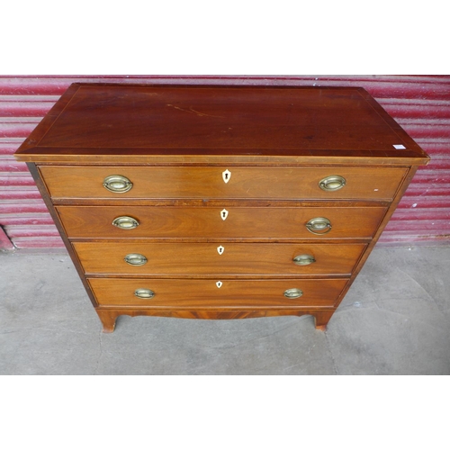 119b - A George III inlaid mahogany chest of drawers