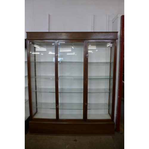 122 - A large mahogany three door shop display cabinet, 215cms h, 185cms w, 38cms d