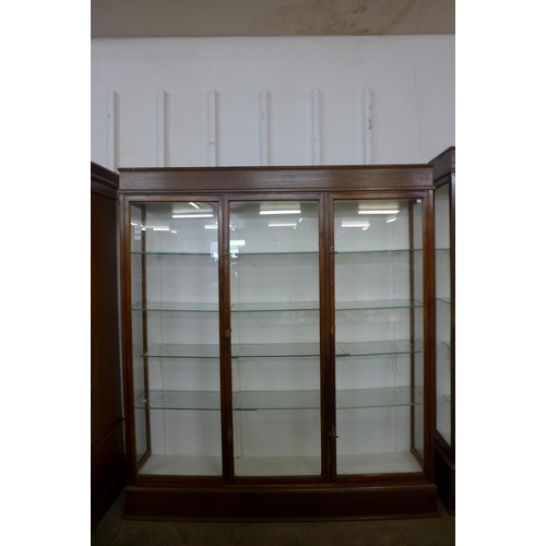 123 - A large mahogany three door shop display cabinet, made by F. Maund & E. Berg Ltd., Showcases & Shopf... 