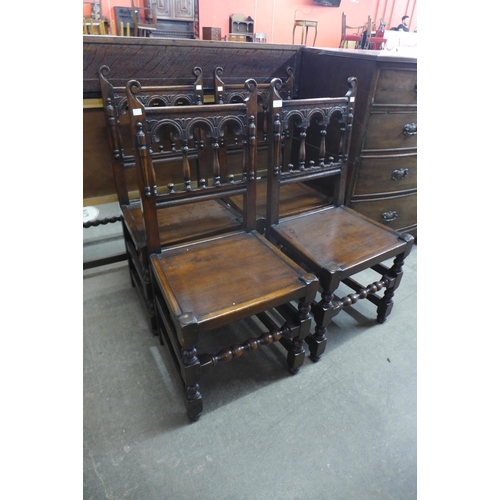 129 - A set of four 17th Century style carved oak chairs