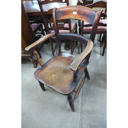 134 - A Victorian elm and beech elbow chair