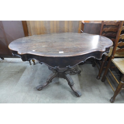 136 - A 19th Century French rosewood two drawer serpentine centre table