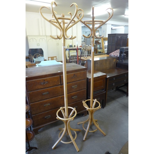 148 - Two beech bentwood coatstands