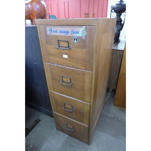 151 - An oak filing cabinet