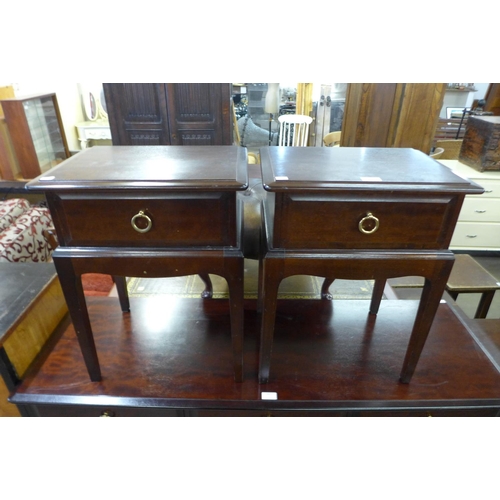 162 - A pair of Stag Minstrel mahogany bedside tables