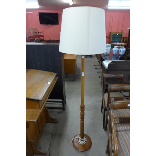 165 - A teak standard lamp