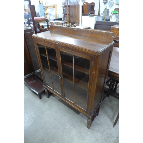 169 - An oak two door bookcase