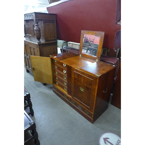 174 - A campaign style yew wood and brass mounted fitted cabinet