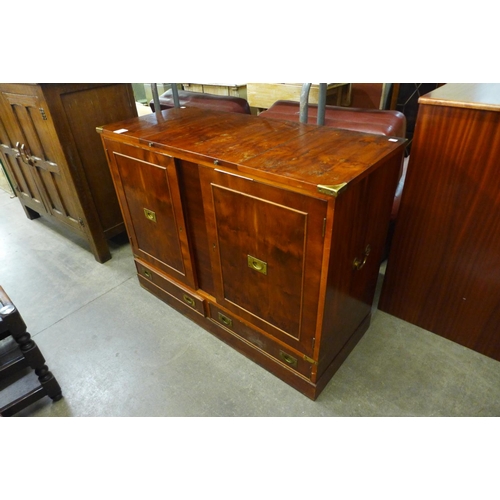 174 - A campaign style yew wood and brass mounted fitted cabinet