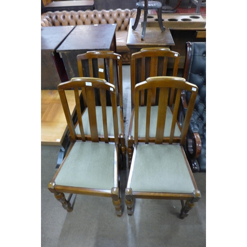 178 - A set of four oak dining chairs