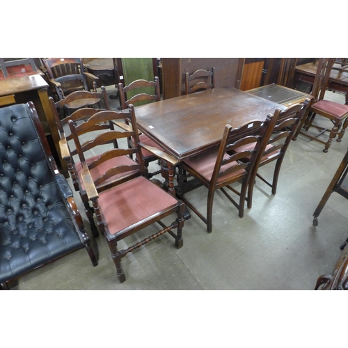 180 - An oak draw-leaf refectory table and six chairs