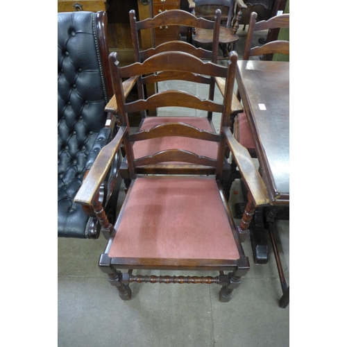 180 - An oak draw-leaf refectory table and six chairs