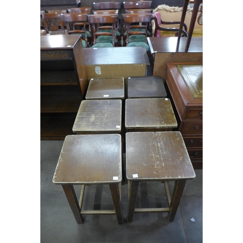 185 - A set of six beech laboratory stools