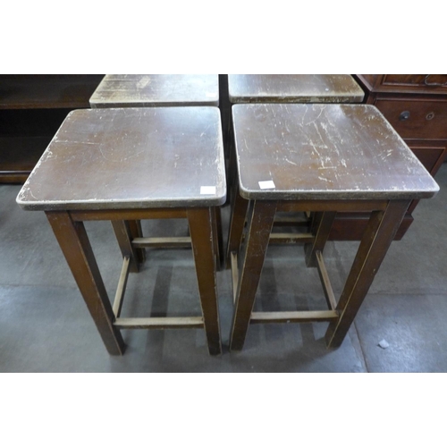 185 - A set of six beech laboratory stools