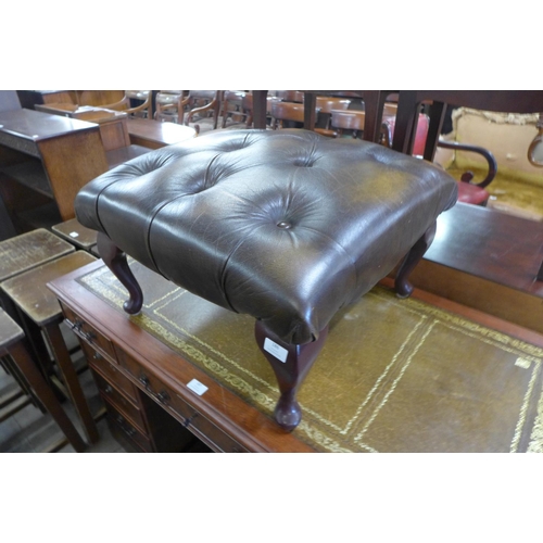 186 - A Thomas Lloyd green leather footstool