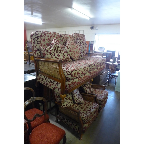 189 - A mahogany bergere settee and pair of armchairs, a/f