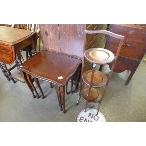 199 - An oak folding cake stand and an inlaid mahogany nest of tables