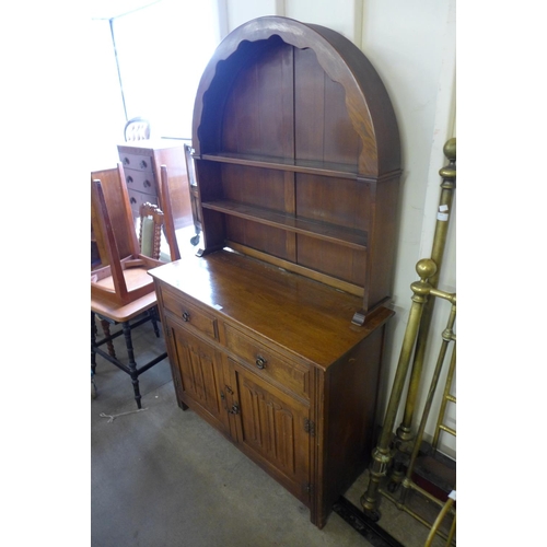 202 - A carved oak linenfold dresser