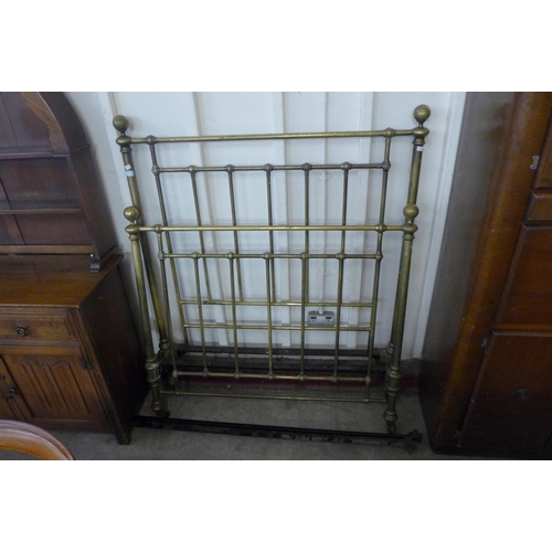 203 - A Victorian brass 4ft bed