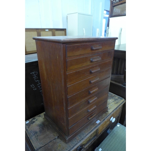 219 - A stained pine table top eight drawer collectors cabinet