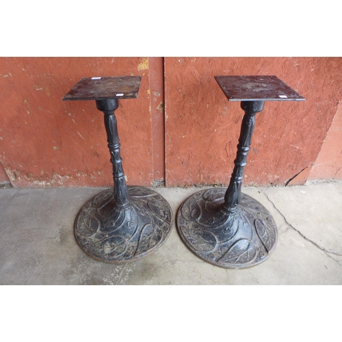 224b - A pair of cast iron pub table bases