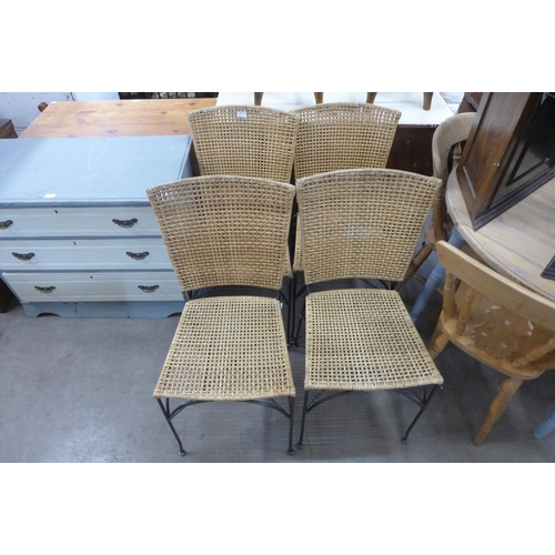 234 - A set of four metal and wicker chairs