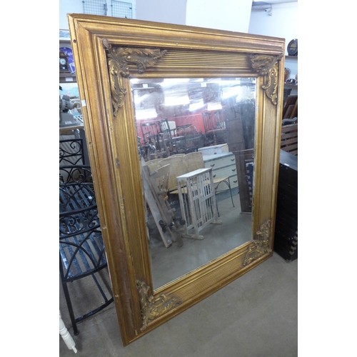 247 - A large gilt framed mirror