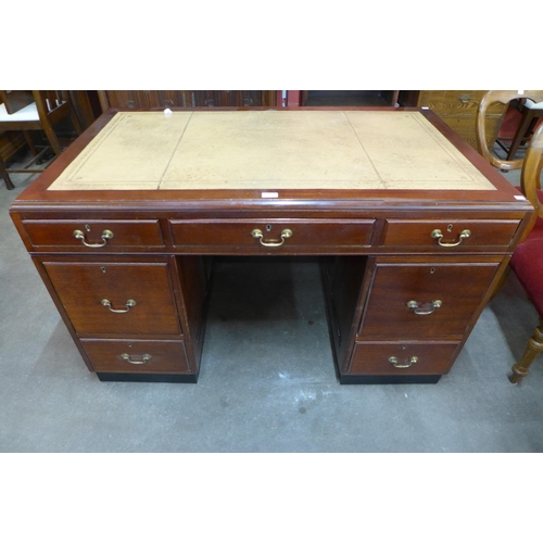 25 - A mahogany and leather topped library desk