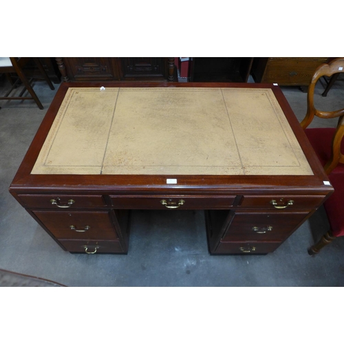 25 - A mahogany and leather topped library desk